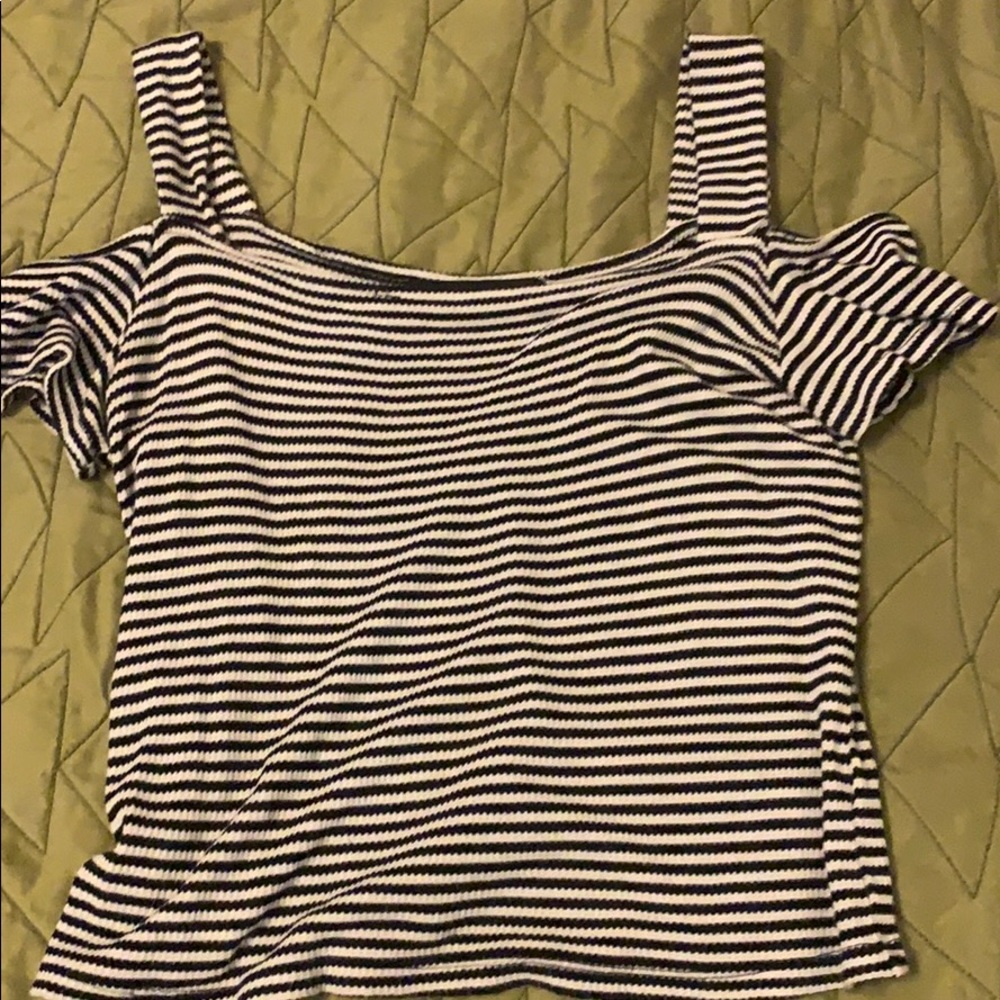 Black and white shirt, kind of short